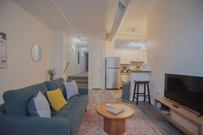 Apartment | Living area | 42-inch Smart TV with digital channels, Netflix, Hulu - CozySuites The Block Skybridge Access (Indianapolis)