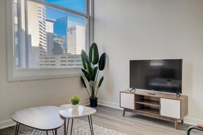 Apartment | Living area | 42-inch Smart TV with digital channels, Netflix, Hulu - CozySuites The Block Skybridge Access (Indianapolis)