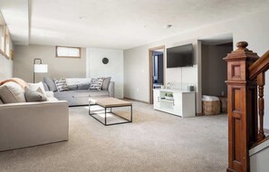 TV, books - Upscale Modern Oasis: Spacious & Chic with HotTub! (Traverse City)