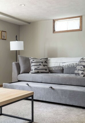 TV, books - Upscale Modern Oasis: Spacious & Chic with HotTub! (Traverse City)