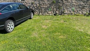 A stone wall with a car parked in front. - BASTINICA KRK Studio Ap 1, OldTown, CityCenter (Krk)