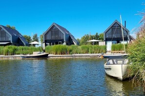 Enjoy serene lakeside views and leisure activities like boating from this tranquil retreat.