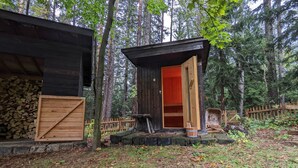 A rustic cabin with a wooden door and a small porch area. - Holiday Home in Edlitz near Ski Slopes (Edlitz)
