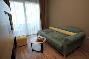 In-room safe, desk, laptop workspace, soundproofing - Alvin Comfort Hotel (Rrashbull)