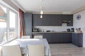 Fridge, microwave, stovetop, coffee/tea maker