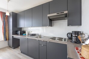 Fridge, microwave, stovetop, coffee/tea maker