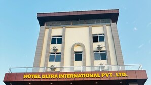 A multi-story building with a sign reading "HOTEL ULTRA INTERNATIONAL PVT. LTD." - Hotel Ultra International (Siddharthanagar)