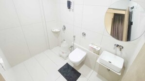 A modern bathroom with a toilet, sink, and shower. - Hotel Kant by GoHotels - Near Shree Dwarkadhish Temple (Dwarka)