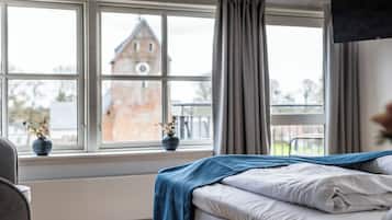 Habitación doble Confort | Ropa de cama de alta calidad, minibar y decoración personalizada