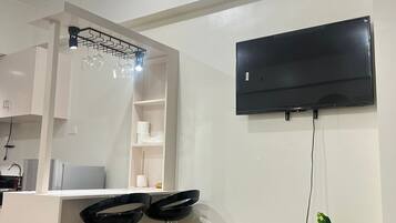 Habitación exclusiva | Zona de estar | Una televisión de pantalla plana