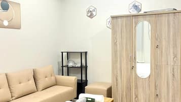 Exclusive Room | Living area | Flat-screen TV