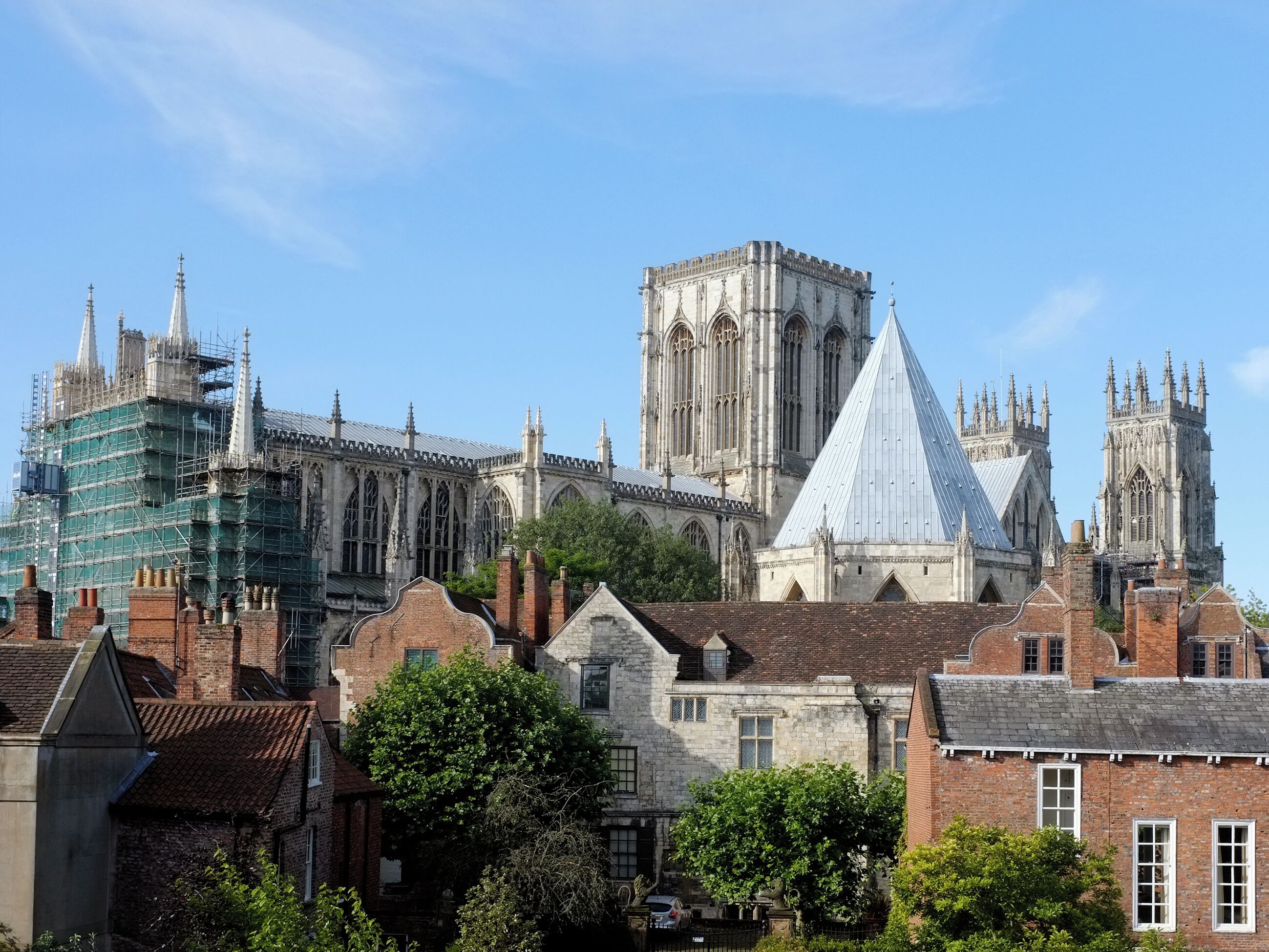 A historic building with Gothic architecture, including pointed arches and a large central tower.