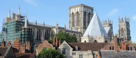 A historic building with Gothic architecture, including pointed arches and a large central tower.