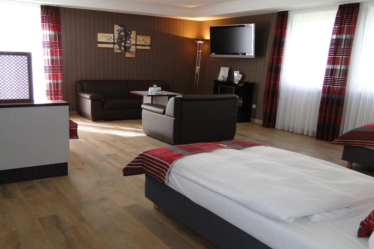 Family Quadruple Room | Minibar, in-room safe, desk, laptop workspace