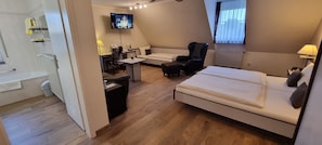 Comfort Triple Room | Minibar, in-room safe, desk, laptop workspace