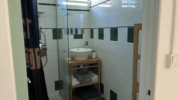 Shower, towels, soap, toilet paper