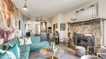 TV, fireplace, books
