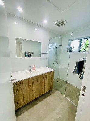 Shower, hair dryer, towels, soap