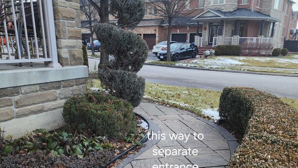 A pathway leading to a house with a separate entrance. - Zen Nest - Cozy, conveniently located, and just minutes to the airport! (Brampton)