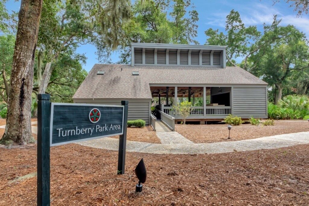 A building with a covered porch and a sign indicating it is the Turnberry Park Area.