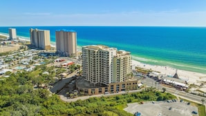 A coastal hotel with multiple high-rise buildings, a beach, and a parking area. - Origin 635: Stunning Gulf Views | High-Demand Condo | Free Activities! (Panama City Beach)