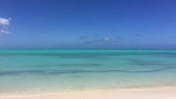 On the beach, sun loungers, beach towels