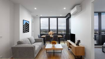 65-inch flat-screen TV with digital channels, Netflix, Hulu