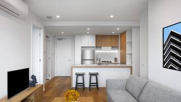 65-inch flat-screen TV with digital channels, Netflix, Hulu