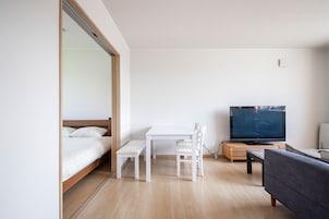 Basic Apartment | Living area | Flat-screen TV