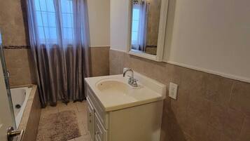 Jetted bath, hair dryer, towels, soap