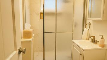 Shower, hair dryer, towels, soap