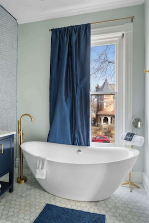 Shower, hair dryer, towels, shampoo - Derby City Delight | Luxe 4BR • Perfect Location (Louisville)