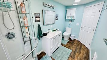 Shower, hair dryer, towels, soap