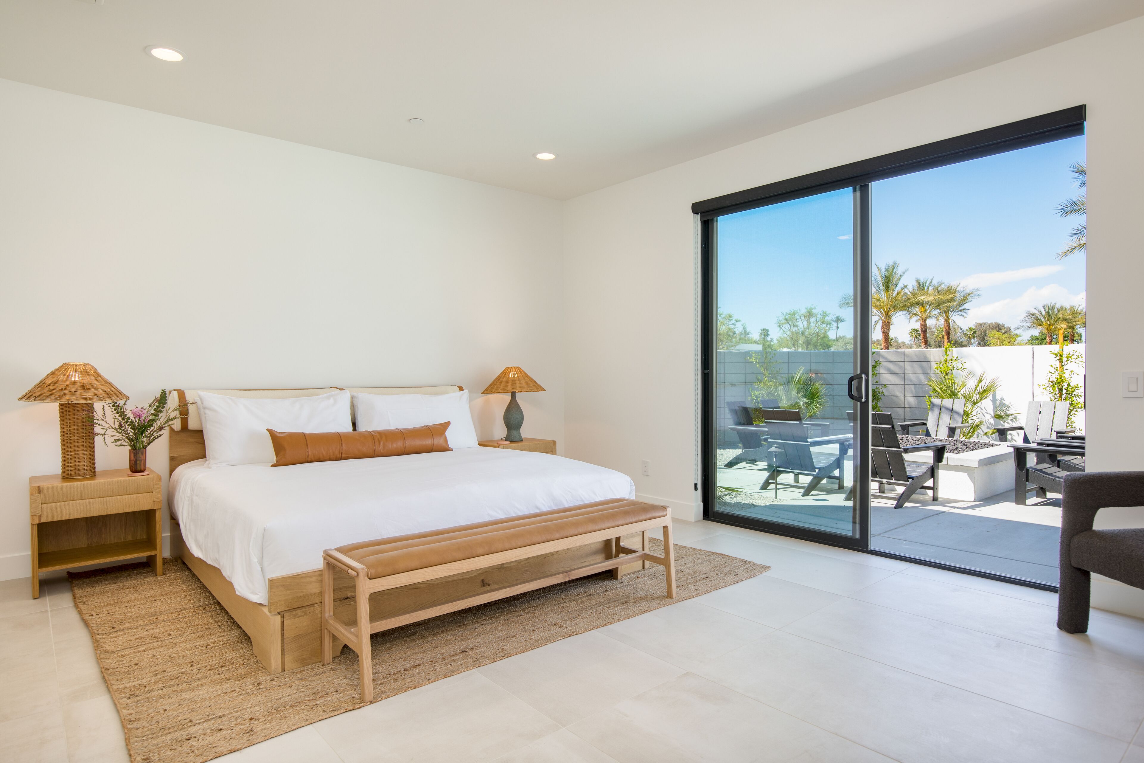 Bedroom 5 features a king bed, patio, desk, TV, and ensuite bathroom.