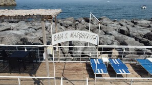On the beach, black sand