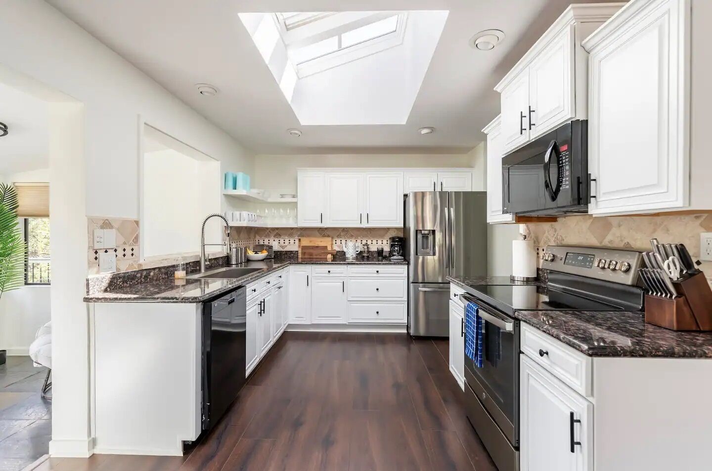 Fridge, stovetop, dishwasher, coffee/tea maker