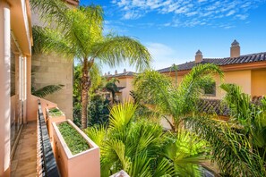 Surrounded by lush greenery, this tranquil courtyard offers a peaceful escape.