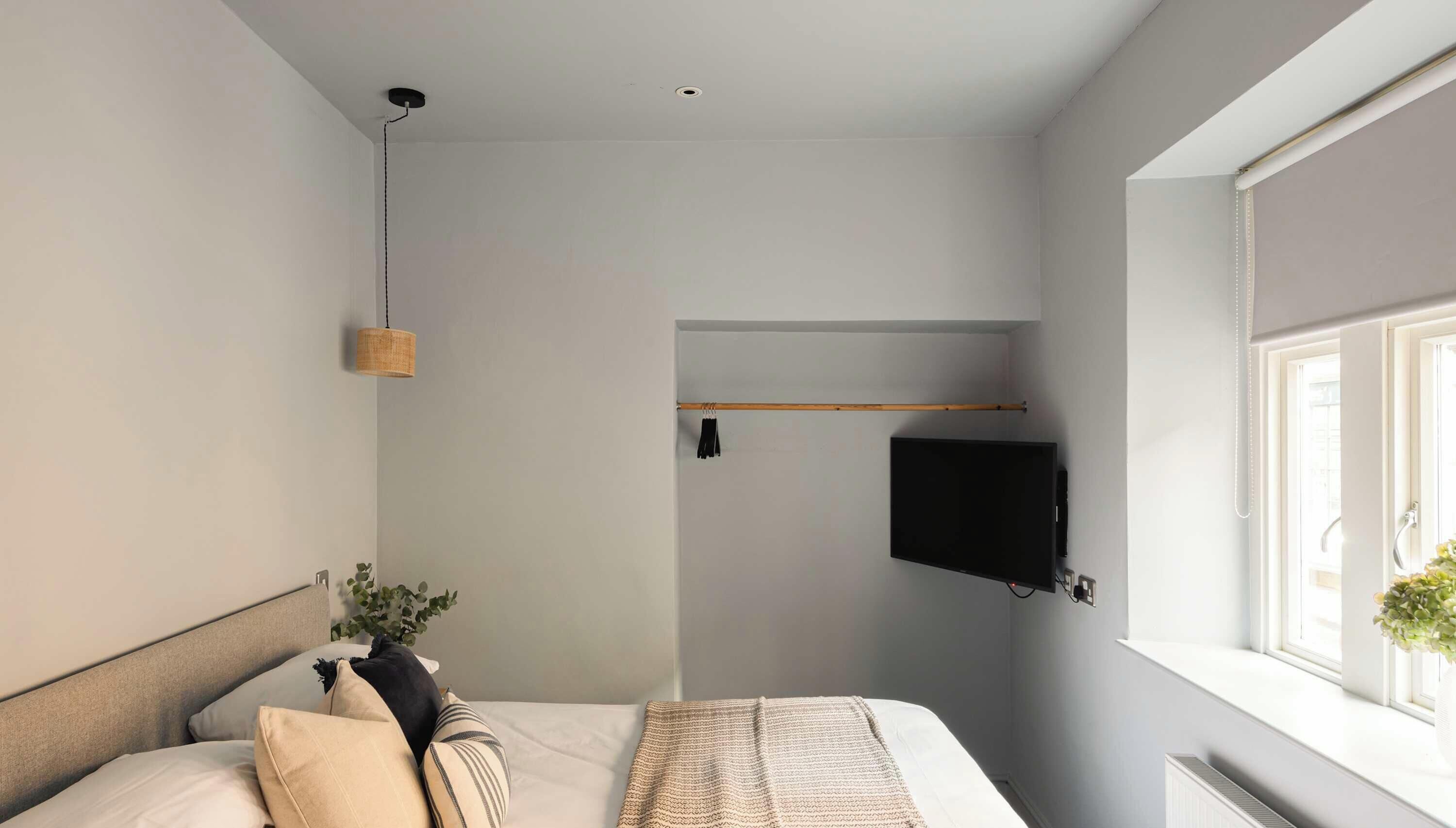 1 bedroom, desk, iron/ironing board, travel crib