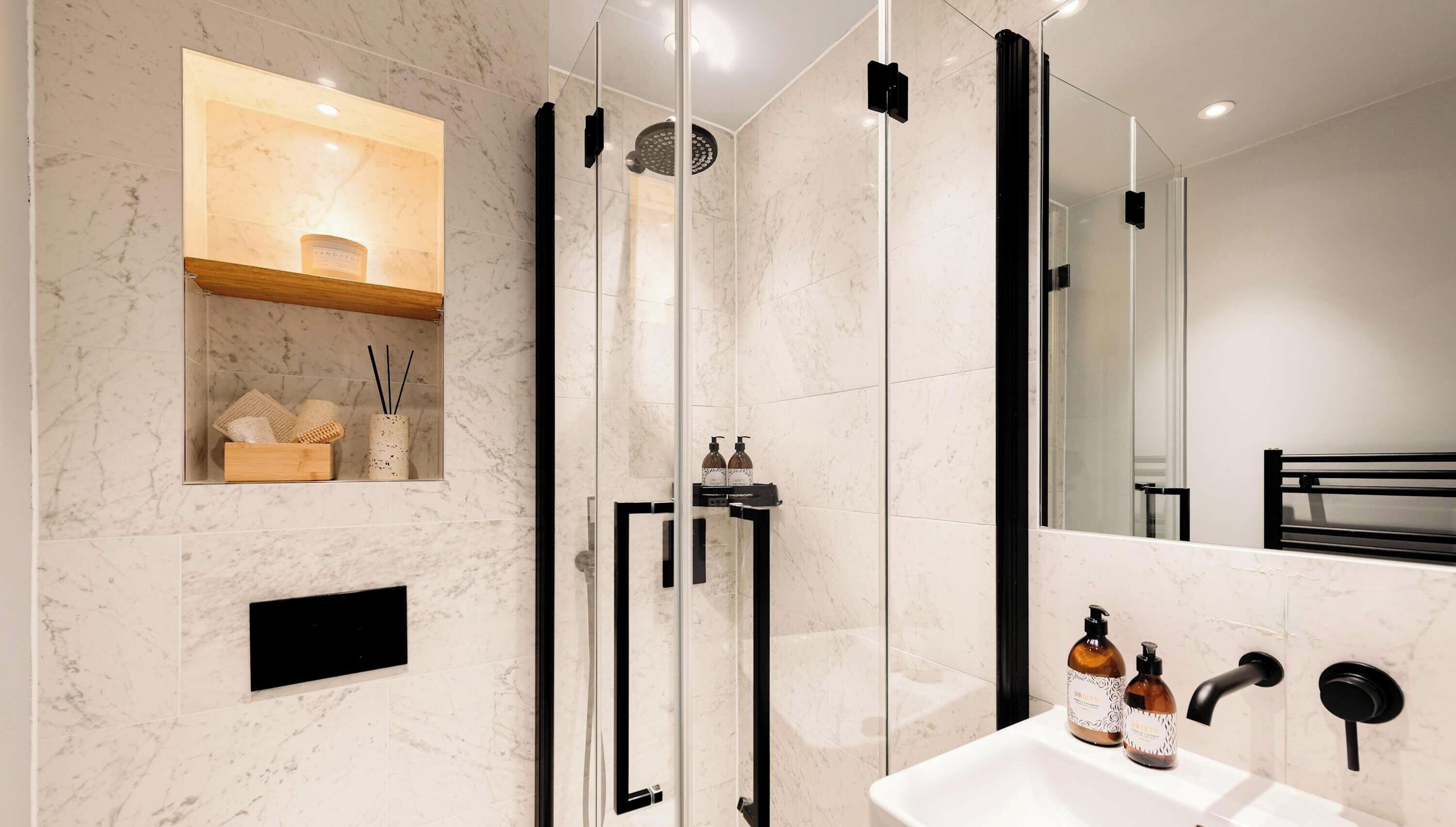 Shower, hair dryer, towels, shampoo