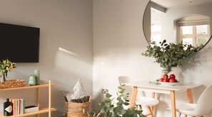 Relax in this stylish room with a flat-screen TV, dining area, and comfortable seating.