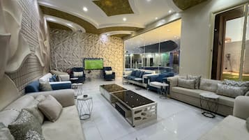 Deluxe Chalet | Living area | Fireplace