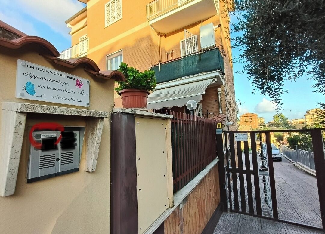 A building with a sign indicating it is a tourist accommodation.