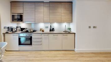 Fridge, microwave, oven, dining tables