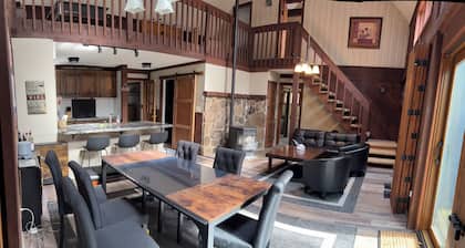 This dramatic home Located inside THE HIDEOUT offers a unique layout