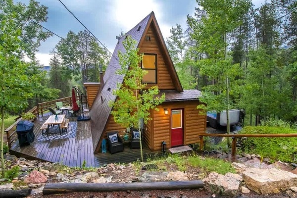 1. Escape to this cozy cabin nestled in the woods, where tranquility meets nature. Surrounded by towering trees, this serene retreat offers the perfect blend of comfort and seclusion. Whether you're relaxing by the fire or exploring nearby trails.