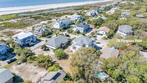 An aerial view of a coastal residential area with houses, a beach, and a clear sky. - Private Pool-Fripp Island-Steps From The Beach (Fripp Island)