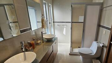 Shower, hair dryer, towels, soap