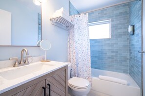 Shower, hair dryer, towels, soap