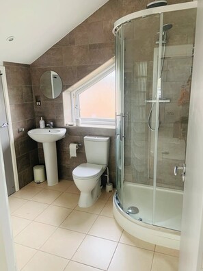 Shower, hair dryer, towels