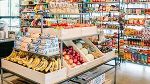 A grocery store with various food items on shelves and in bins, including bananas, apples, and packaged goods. - Chic Apt w/parking - Walk to Capitol, Convention Center, museums & shops! (Denver)